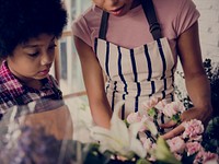Mom Teaching Kid about Flowers in Flora Shop