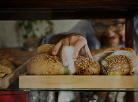 Man Hand Picking Baked Bread