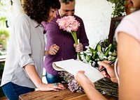 Customers choosing flowers in the shop