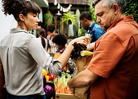 People Buying Vegetable From Shop at Market