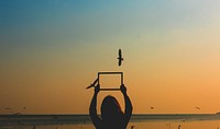 Girl holding an empty frame border silhouette