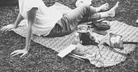 An Adult Woman Sitting and Picnicking in The Park