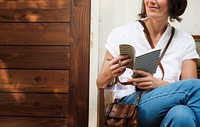 Woman holiday lifestyle wrting dairy relax at cafe