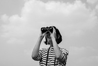 An Adult Woman Using Binocular Towards the Sky
