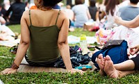 An Adult Woman Sitting and Picnicking in The Park