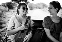 Girlfriends on the road trip to the nature
