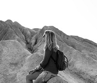 Woman take a rest from hiking on the rock