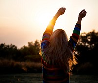 Silhouette of a girl stretching in the morning