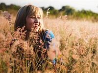 Woman smiling candid portrait in the meadow