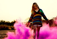 Person having fun with pink powder