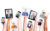 Hands Holding Digital Devices with Professional People's Images