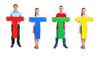 Multi-ethnic group of people holding letter "T"