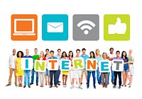 Multi-Ethnic Group Of People Holding Alphabet To Form Internet And Internet Themed Images Above