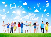 Group Of Multi-Ethnic People Social Networking Outdoors And Related Symbols Above