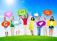 Diverse Multi-Ethnic People Outdoors Holding Social Network Related Speech Bubbles