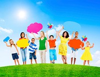 Group of Mixed Age Holding Colorful Speech Bubbles in a Summer Concept Photo