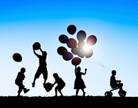 Silhouettes of Children Playing Balloons and Riding Bicycle