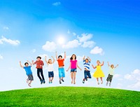 Group of Diverse Multi-Ethinc Children Jumping Outdoors