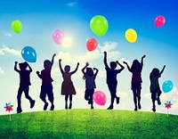 Children Outdoors Playing Balloons Together