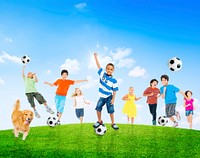 Multi-Ethnic Children Outdoors Playing Soccer Together and a Pet Dog