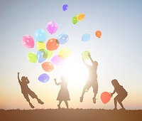Children Outdoors Playing Balloons Together Concept