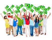 Cheerful Multi-Ethnic Group Of People Standing With Their Arms Raised Holding Brazilian Flag.