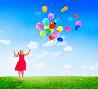 Little Girl Playing with Balloons Outdoors