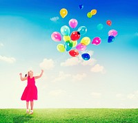 Little Girl Playing with Balloons Outdoors
