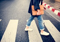 Young man wallking crosswalk commuter lifestyle