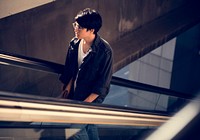 Young asian using escalator routine life