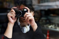 Guy taking a photo with a digital camera