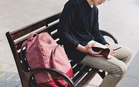 Guy sitting on a bench alone