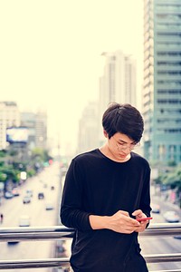 Asian man using mobile phone connection technology