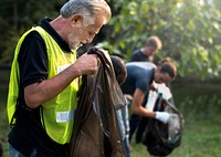 Ecology group of people cleaning the park