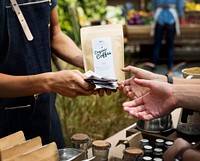 Man Selling Coffee Fresh Brew to People at Market