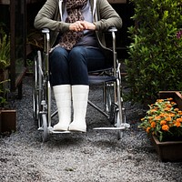 Senior Adult Woman Sitting on Wheelchair in a Park
