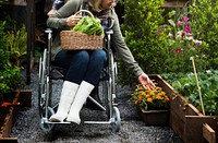 Disabled woman touching the flowers