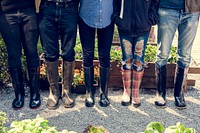 Group of people gardening backyard together