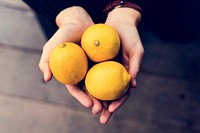 Handful of organic fresh agricultural lemon