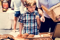 Little Boy Eating Testing Sample Homemade Bread