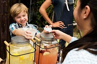 Little Boy Selling Lemonade at Fresh Market