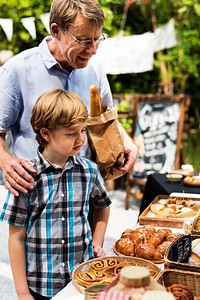 Father and Son Buy Bakery at Market