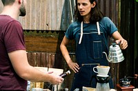 Man Selling Coffee Fresh Brew to People at Market