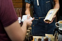 Man Selling Coffee Fresh Brew to People at Market