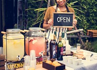 Adult Women with Beverage at Food Stall Market with Open Sign