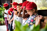 Group of kindergarten kids learning gardening outdoors field trips