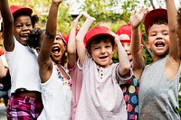 Group of Diverse Kids Hands Raising Up Cheerfully Together