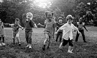 Group of kindergarten kids friends playing playground fun and smiling