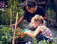 Teacher and little girl school learning ecology gardening
