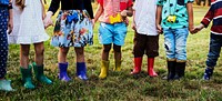 Group of Diverse Kids Holding Hands Together at the Field